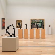 A gallery displaying modernist artworks.