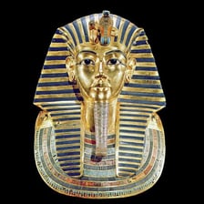 The gold funerary mask of the Egyptian pharaoh Tutankhamun.