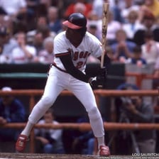 Rod Carew batting in a baseball game.