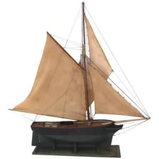 A small sailboat with one mast.