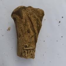 A small fragment broken off from a larger piece.