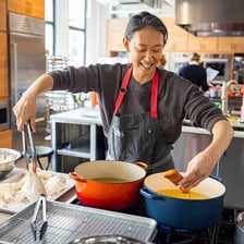 A chef preparing food in a kitchen
