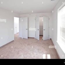 A vacant apartment interior with unfurnished rooms