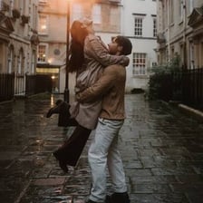 A couple kissing in an English setting