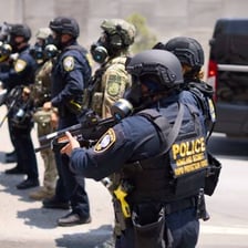 Federal agents conducting an official investigation.