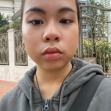 A portrait of a person with a notably round face.