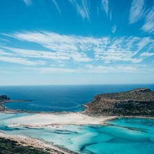 Aerial view of the coastline and landscape of Crete, Greece.