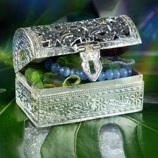 A treasured piece of jewelry rests in a small box.