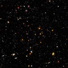 A vast field of stars and galaxies suggesting limitless space