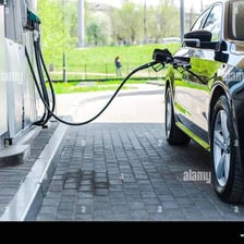 A car being refueled at a gas station