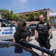 A police officer detaining a crime suspect.