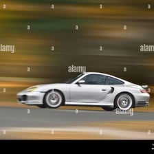 Car traveling rapidly along a highway