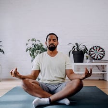 A person sitting cross-legged in meditation