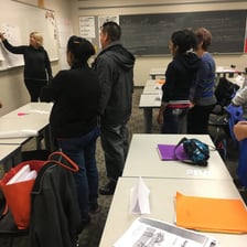 Adult students attending an English-language class