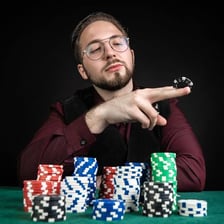 A poker player matching an opponent’s bet with chips