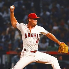 A baseball pitcher delivering a fastball.