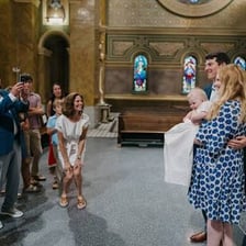 A Christian christening ceremony taking place in a church.