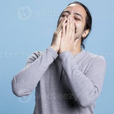 A smiling person reacting with amusement.