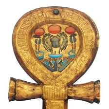 A carved ancient Egyptian ankh, the looped symbol of life.