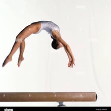 A gymnast demonstrating nimble, controlled movement.