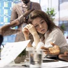 A frustrated employee attending a meeting