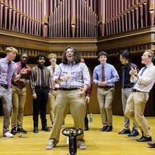 Eight singers performing together in an a cappella group.