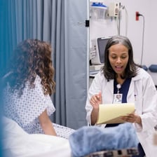 Doctors working in a hospital emergency room.