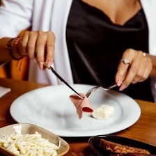 A person enjoying and savoring a meal.