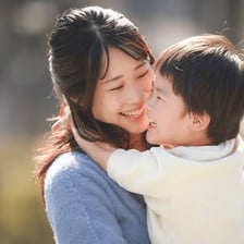 An adult caring for and supporting a child.