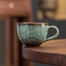 A ceramic mug filled with coffee