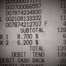 A shopping receipt with tax listed as a separate line.