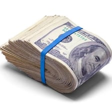 A thick bundle of paper currency held together.