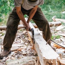 A person chopping wood with an axe