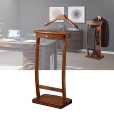 A clothes valet stand holding a suit