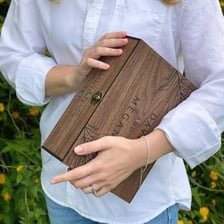 A person holding a box of keepsakes.