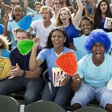 An enthusiastic fan cheering at a sporting event.