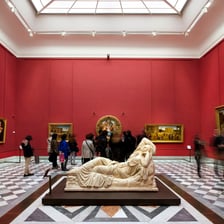 The interior of Florence’s Uffizi Gallery displays paintings and sculptures.