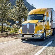 A semitrailer truck traveling on a highway