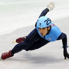 Apolo Ohno competing in a speed-skating race