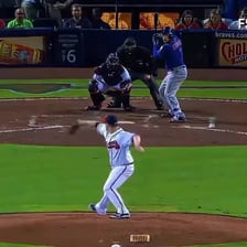 A baseball player crossing home plate