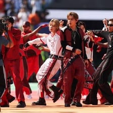 BTS performing onstage during the “Dynamite” era.