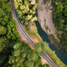 A road curving repeatedly through a landscape.