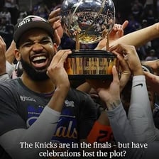 A sports team celebrating with a championship trophy
