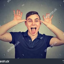 A person making a disapproving expression associated with a tongue click.