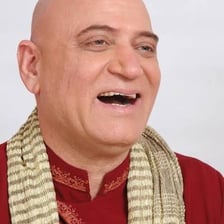 A person giving a restrained nervous laugh