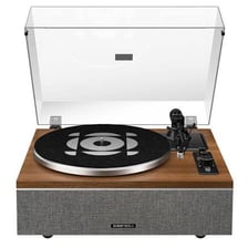 A music producer working with a soul record on a turntable.