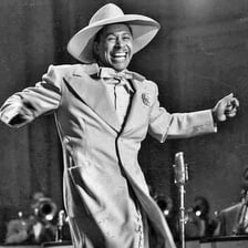 Cab Calloway performing in a vintage jazz setting