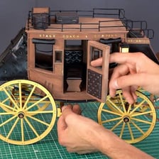 A stagecoach pictured with a small sailing craft