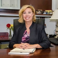 A college dean working in a campus office