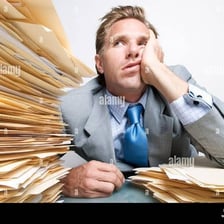 A person looking weary while performing a tedious task.